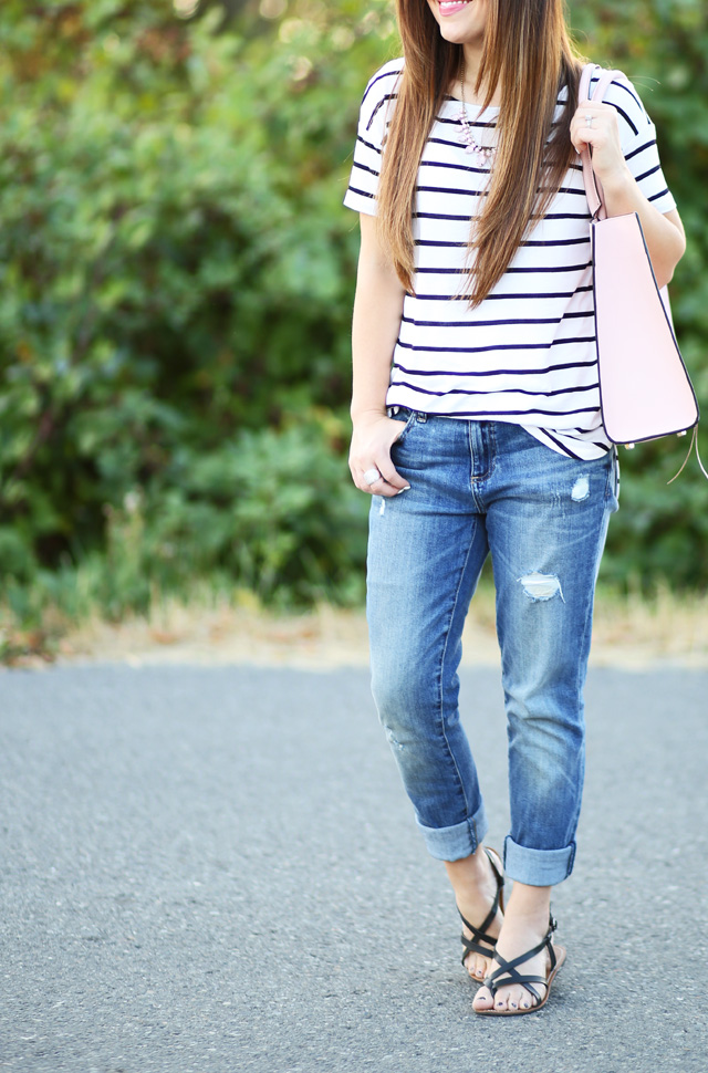 distressed denim and black and white striped shirt