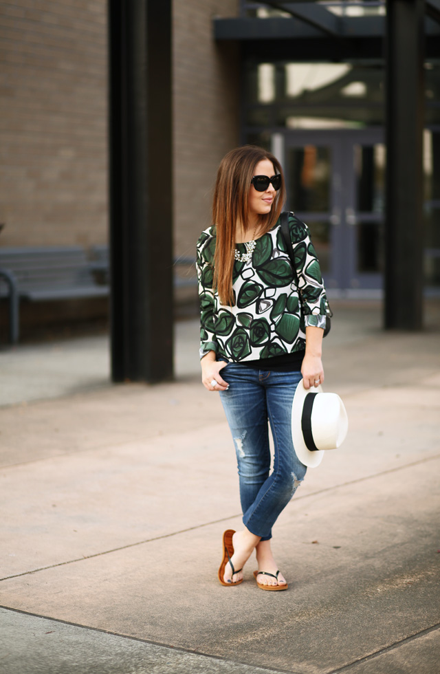 green palm print top and black stripe bag