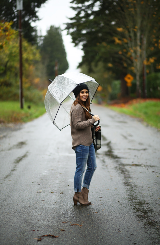 taupe booties and sweater with a slouchy black hat plaid scarf