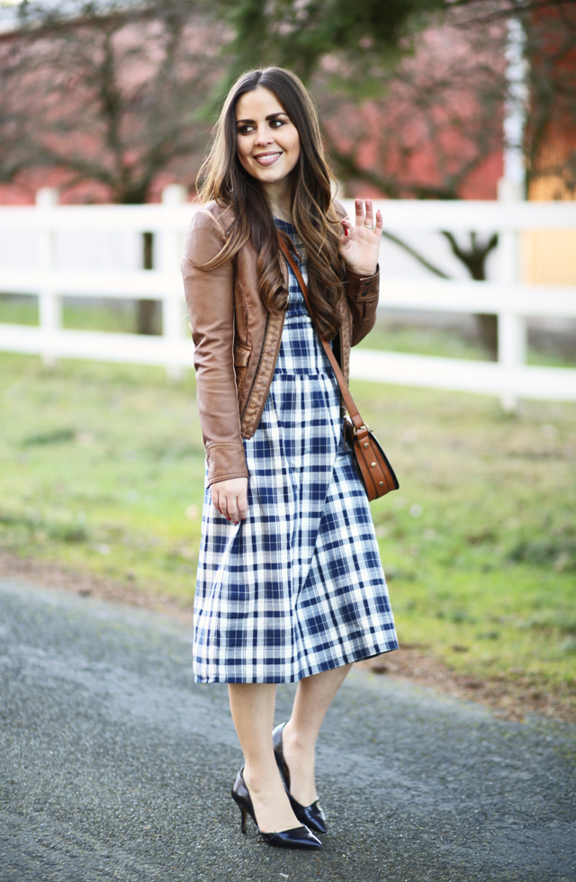 plaid dress cognac leather jacket cognac saddle bag navy pumps