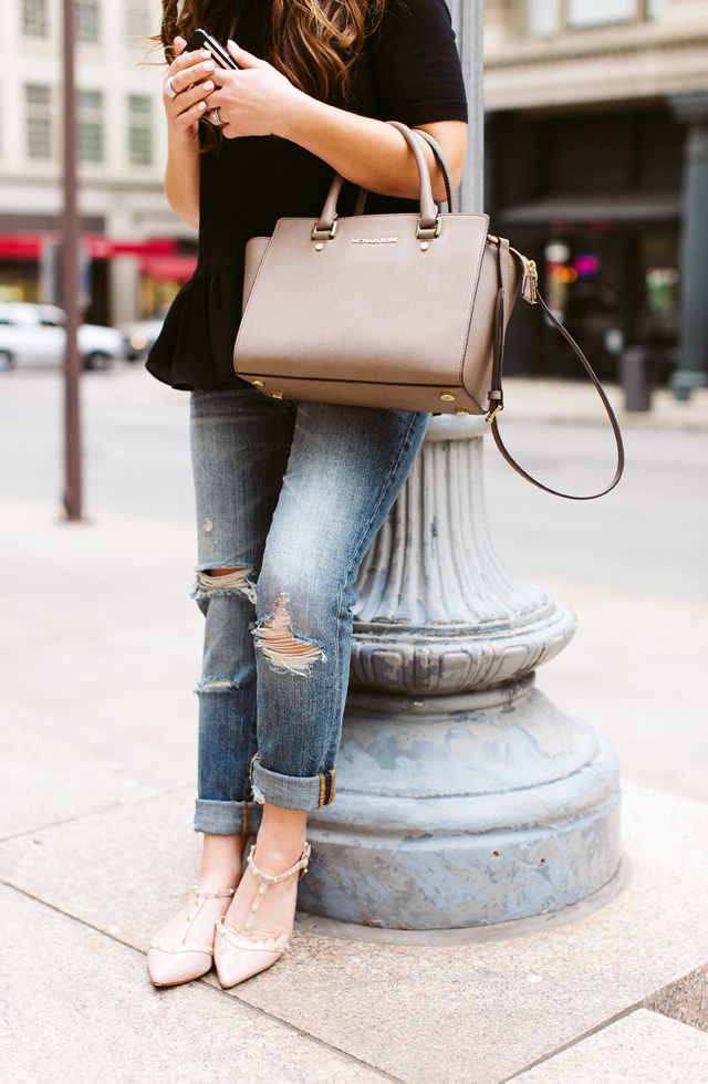 taupe michael kors selma bag ripped boyfriend jeans