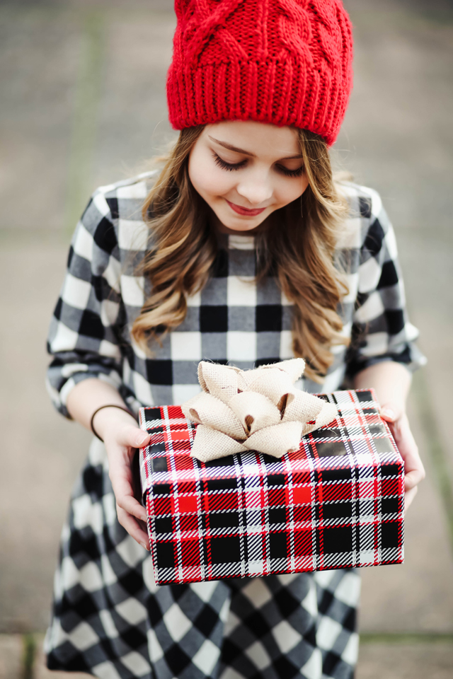 black-and-white-buffalo-check-dress-with-a-red-pom-hat