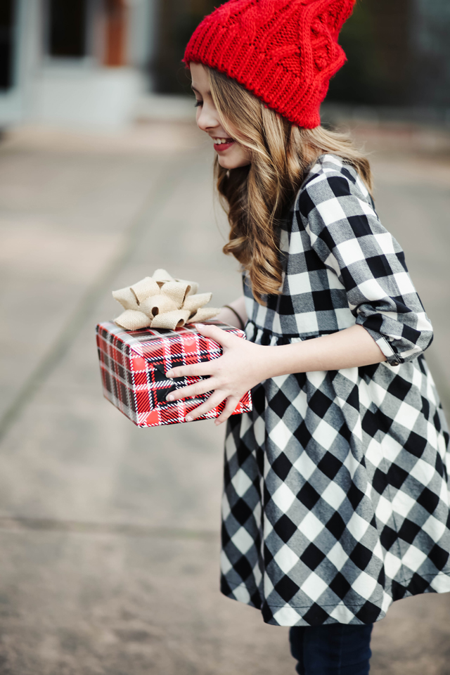 buffalo-check-dress-with-a-red-pom-beanie